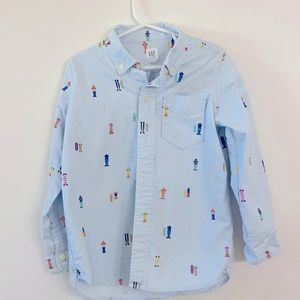 Gap kids button up shirt. XS (4-5). Worn once. Light blue with skateboards.